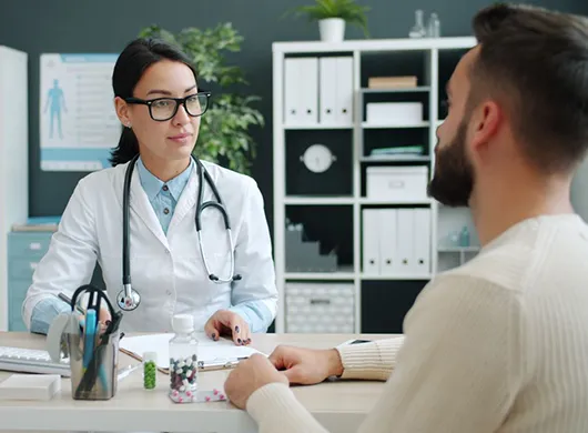 A patient talking to a doctor